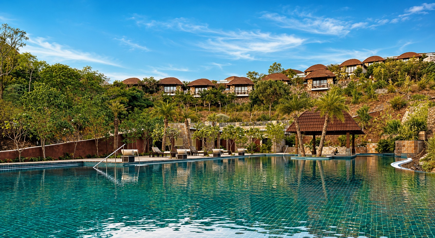The Ananta Udaipur resort beside the lake at golden hour